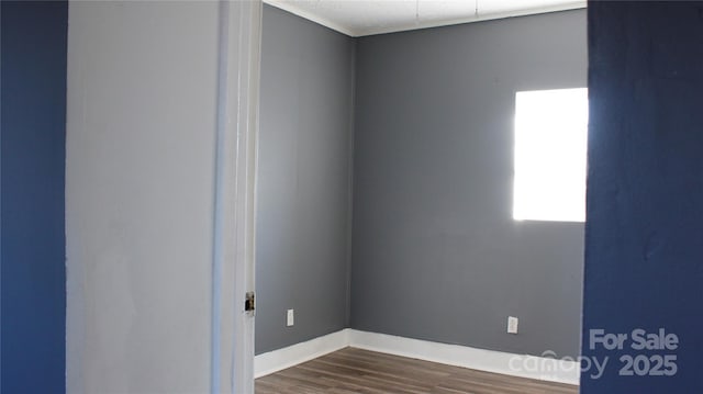 unfurnished room featuring dark hardwood / wood-style flooring