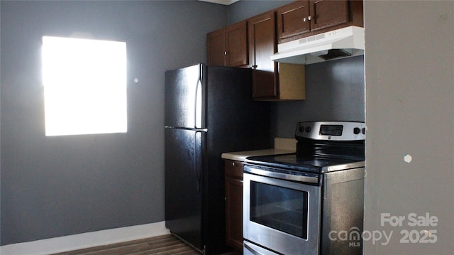 kitchen with stainless steel electric stove, refrigerator, and dark hardwood / wood-style flooring