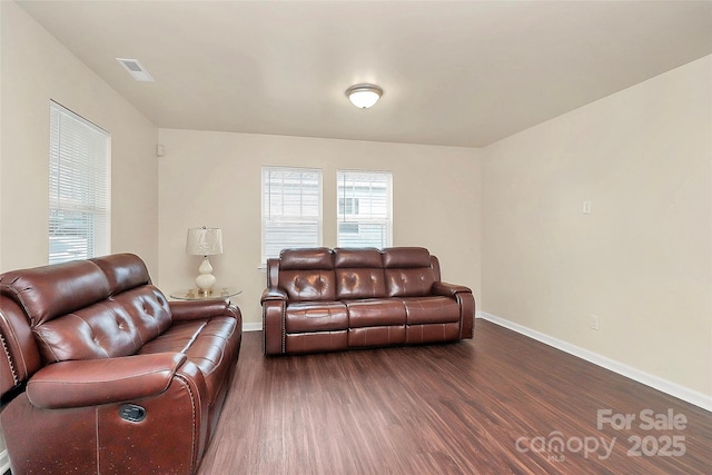 living room with dark hardwood / wood-style flooring