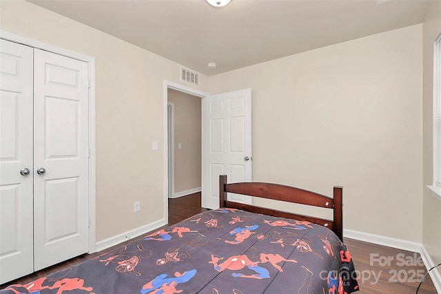 unfurnished bedroom featuring dark wood-type flooring