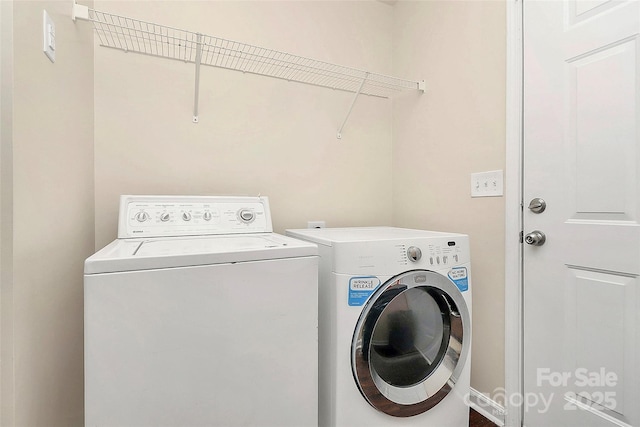 clothes washing area featuring washing machine and dryer