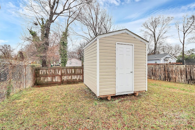 view of outbuilding featuring a lawn