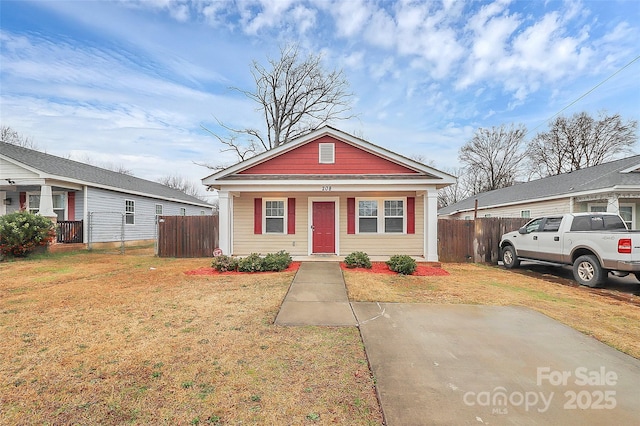 bungalow-style house featuring a front yard