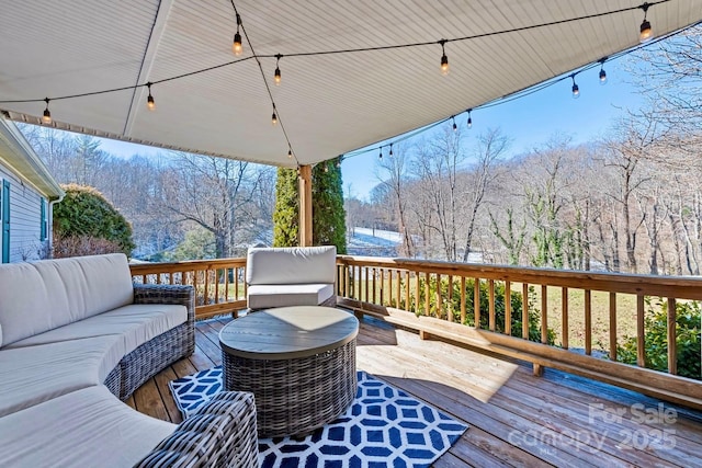 wooden deck featuring outdoor lounge area