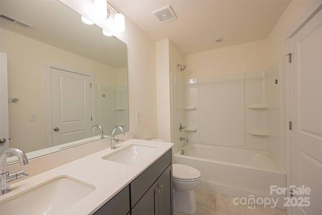 full bathroom featuring tile patterned floors, vanity,  shower combination, and toilet