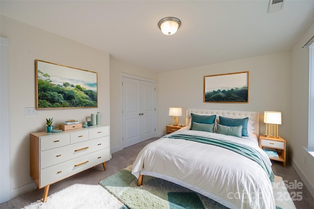 carpeted bedroom with a closet