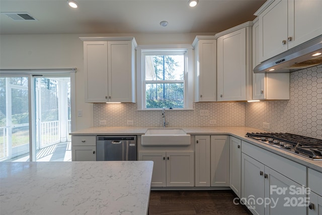 kitchen with sink, white cabinetry, and stainless steel appliances