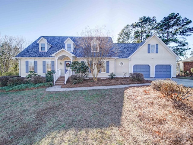 cape cod home with a garage