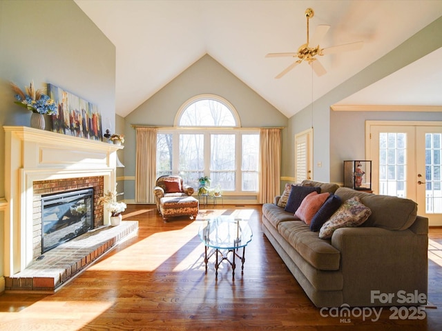 living room with ceiling fan, a fireplace, wood-type flooring, and french doors