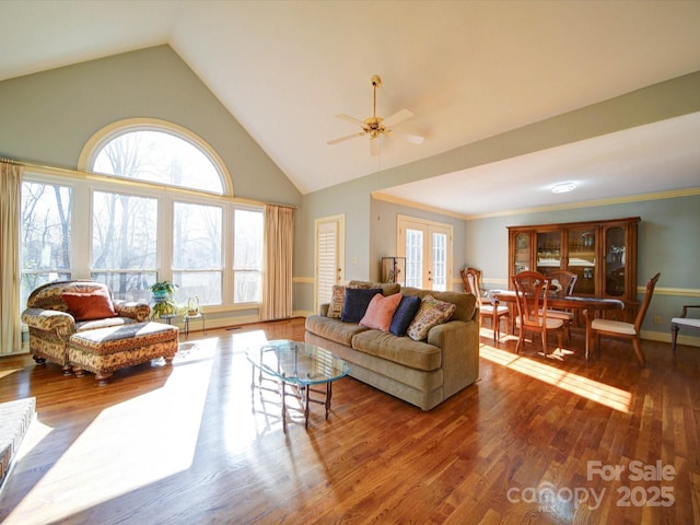 living room featuring french doors, ornamental molding, ceiling fan, hardwood / wood-style flooring, and lofted ceiling