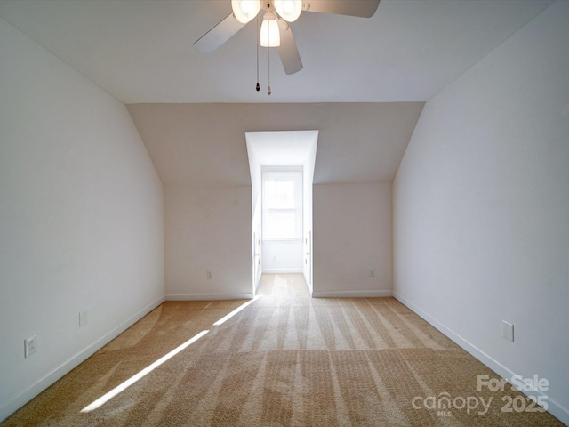 bonus room featuring light colored carpet, ceiling fan, and lofted ceiling