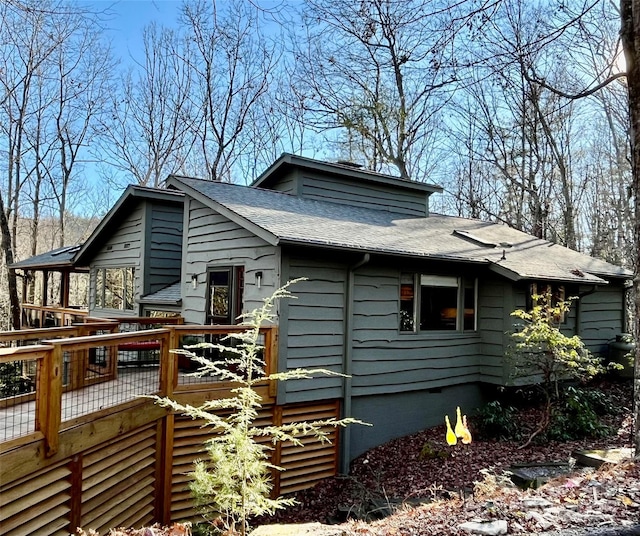 view of side of home with a deck