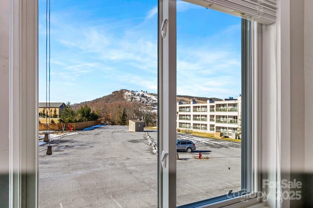 doorway to outside featuring a mountain view