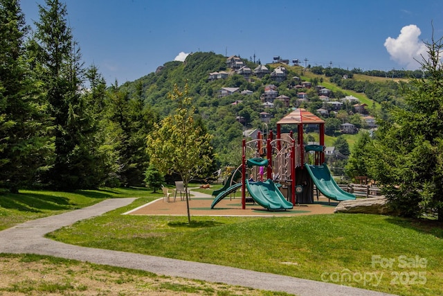 view of playground featuring a lawn