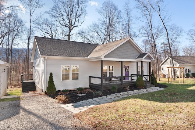 view of front of house featuring a front lawn and covered porch