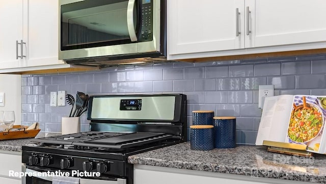 details with tasteful backsplash, stone counters, white cabinets, and black gas range oven