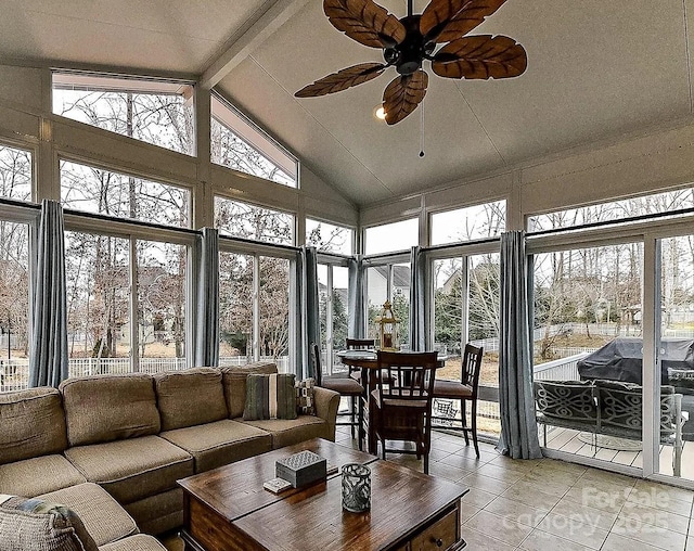 sunroom featuring high vaulted ceiling, tile patterned flooring, and beamed ceiling
