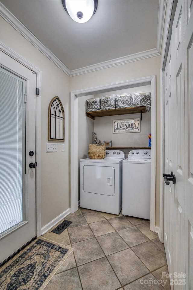 laundry area featuring separate washer and dryer and crown molding