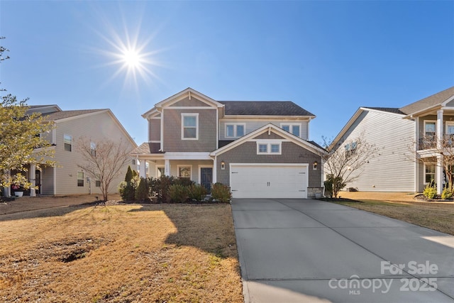 view of front of property with a front yard and a garage