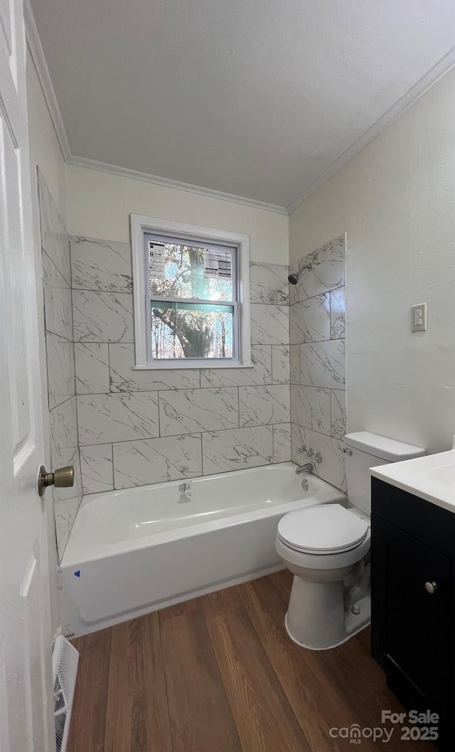 full bathroom featuring tub / shower combination, crown molding, vanity, and wood finished floors