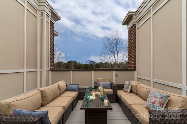 view of patio / terrace with outdoor lounge area and a wooden deck