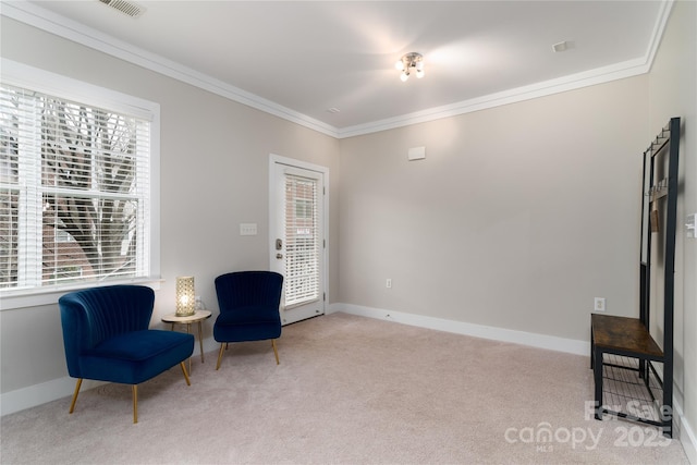 sitting room with light carpet and crown molding