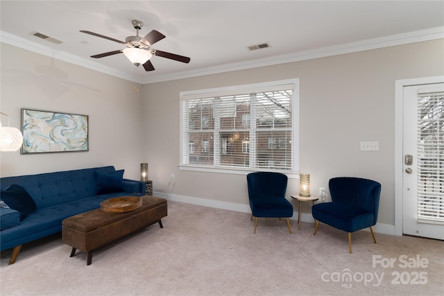 living room with light carpet, ceiling fan, and crown molding