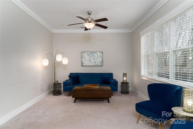 living area with light carpet, ceiling fan, and crown molding