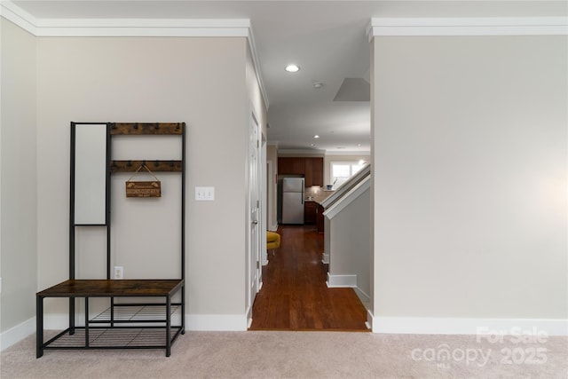 corridor featuring carpet and ornamental molding