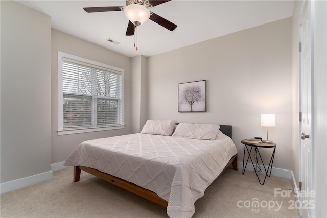 bedroom featuring ceiling fan and light carpet