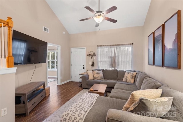 living room with dark hardwood / wood-style floors, high vaulted ceiling, and ceiling fan