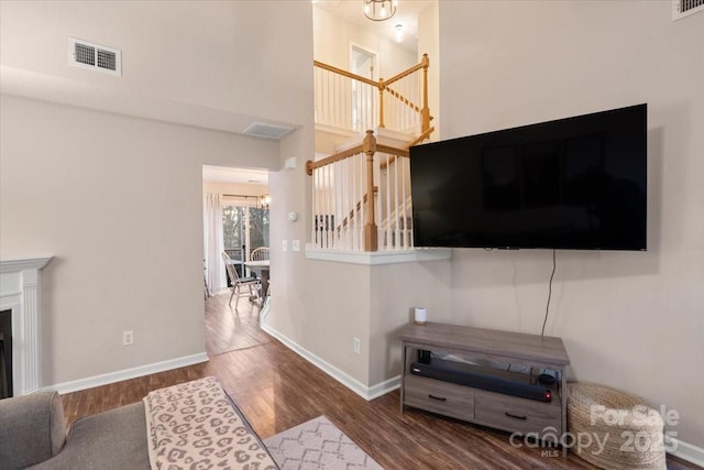 living room featuring hardwood / wood-style floors and an inviting chandelier