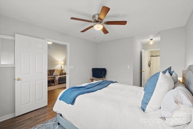 bedroom with ceiling fan and dark wood-type flooring