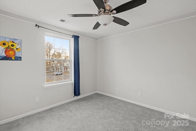 spare room with carpet flooring and ceiling fan