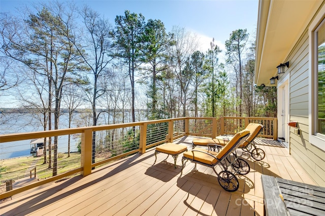 wooden deck featuring a water view