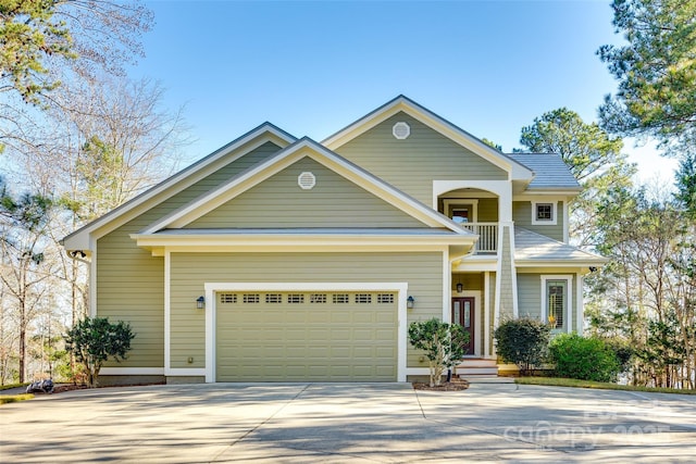 view of front of house with a balcony and a garage