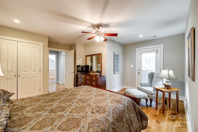 bedroom featuring light hardwood / wood-style floors and ceiling fan