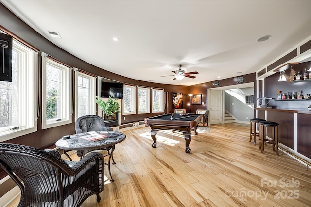 playroom with bar area, ceiling fan, light wood-type flooring, and billiards