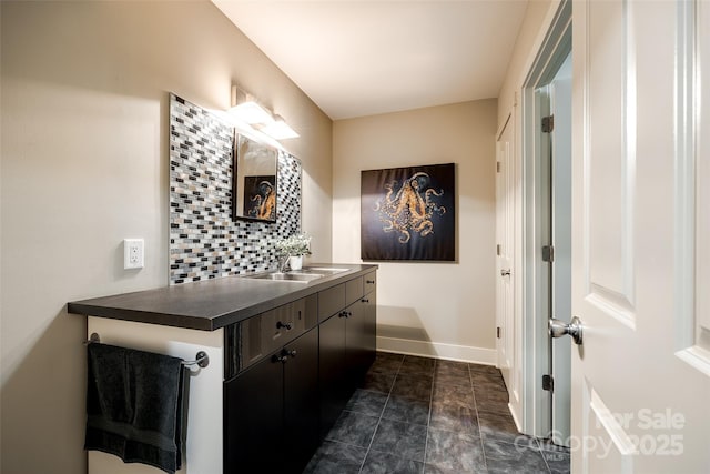 bathroom with vanity and backsplash