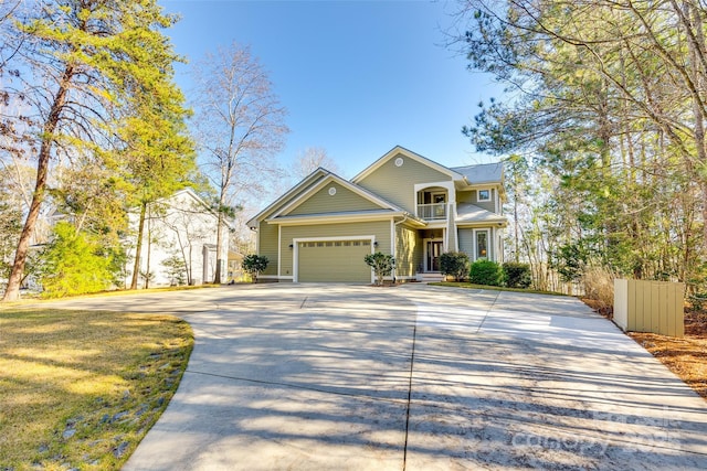 view of front of home featuring a garage and a balcony