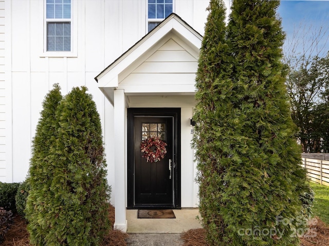 entrance to property featuring board and batten siding