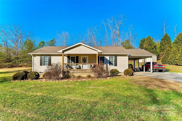 ranch-style home featuring covered porch and a front yard