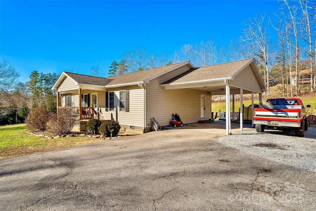 view of side of home with a carport