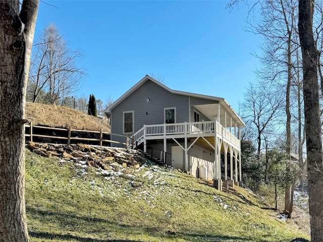 back of house featuring a deck