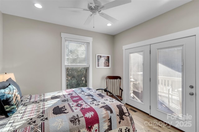 bedroom featuring ceiling fan, access to exterior, and light hardwood / wood-style flooring