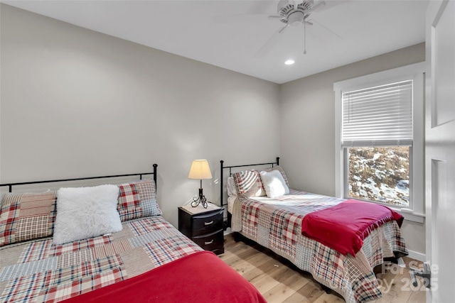 bedroom featuring ceiling fan and light hardwood / wood-style flooring