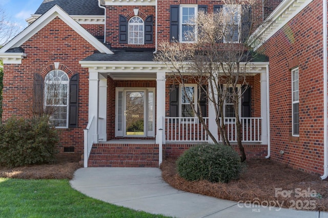 doorway to property with covered porch