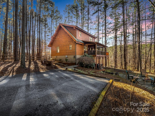 view of front of property with a sunroom