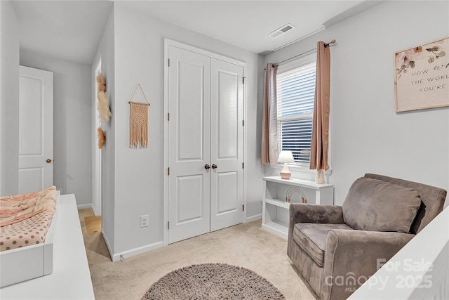 sitting room with light colored carpet