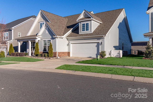 view of front of house with a garage and a front yard